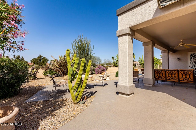 view of patio with ceiling fan and outdoor lounge area