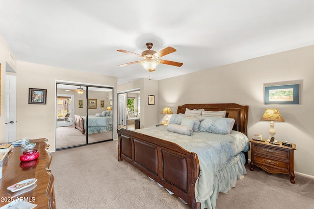 bedroom featuring light carpet and a ceiling fan