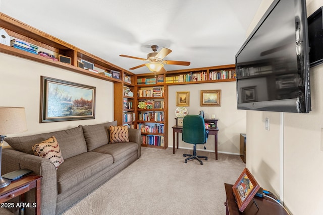 home office with ceiling fan, carpet flooring, and baseboards