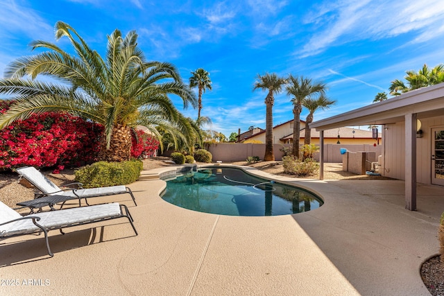 view of swimming pool featuring a fenced in pool, a patio, and fence