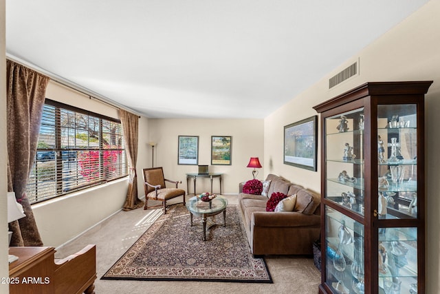 living room featuring carpet and visible vents