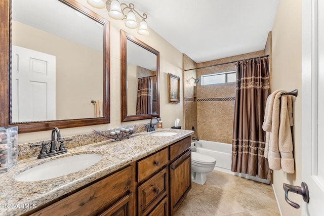 bathroom featuring double vanity, shower / bath combo, a sink, and toilet