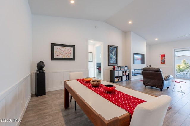 3834 E Clarendon Ave, Phoenix, AZ 85018 - dining area featuring wood finished floors, vaulted ceiling, wainscoting, and recessed lighting