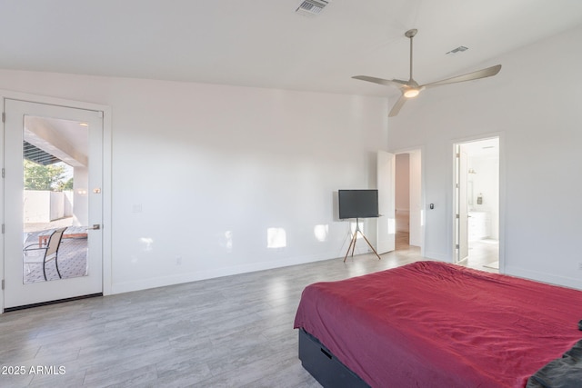 3834 E Clarendon Ave, Phoenix, AZ 85018 - bedroom with light wood-type flooring, baseboards, connected bathroom, and access to exterior