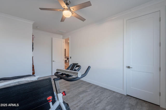 3834 E Clarendon Ave, Phoenix, AZ 85018 - workout area featuring ornamental molding, wood finished floors, a ceiling fan, and baseboards