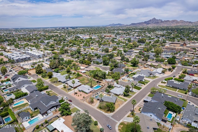 3834 E Clarendon Ave, Phoenix, AZ 85018 - aerial overview of property's location with a mountainous background and nearby suburban area