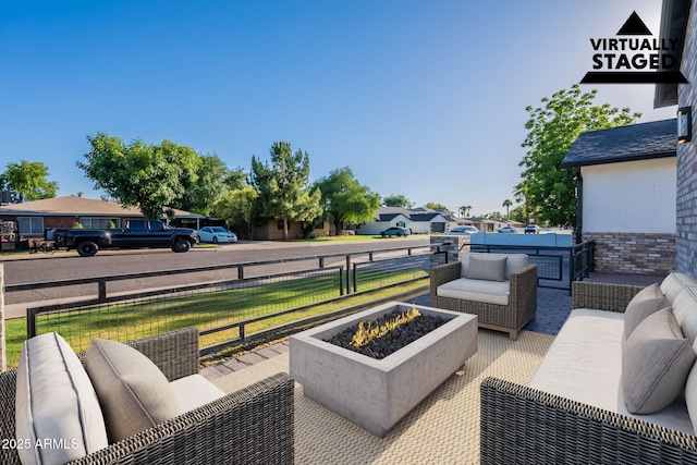 3834 E Clarendon Ave, Phoenix, AZ 85018 - view of patio with an outdoor living space with a fire pit and a residential view