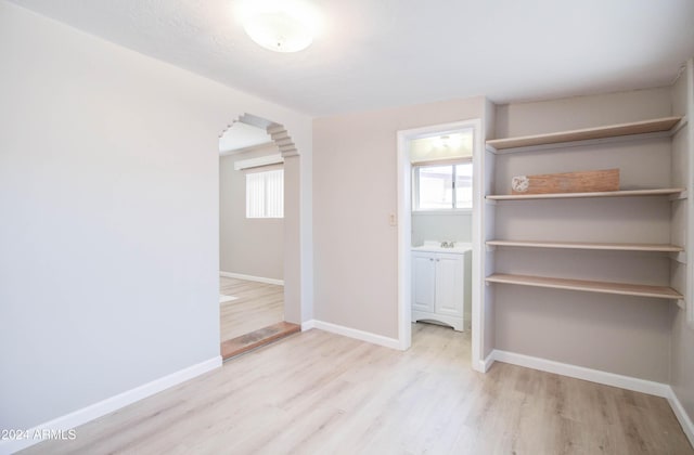 interior space with light wood-type flooring and sink