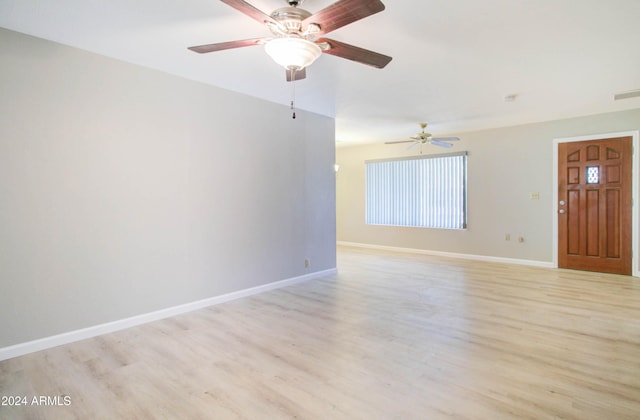 interior space with light wood-type flooring and ceiling fan