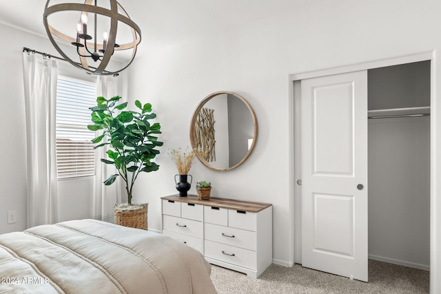 18348 W Gray Fox Trl, Wittmann, AZ 85361 - bedroom featuring a closet, light colored carpet, a notable chandelier, and baseboards