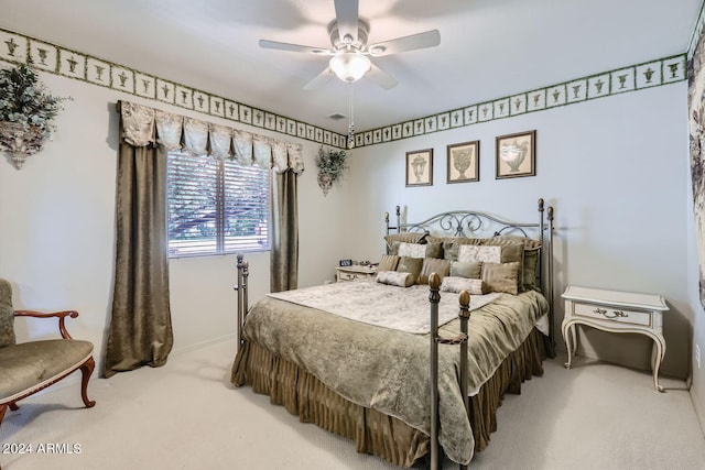 bedroom with ceiling fan and light colored carpet