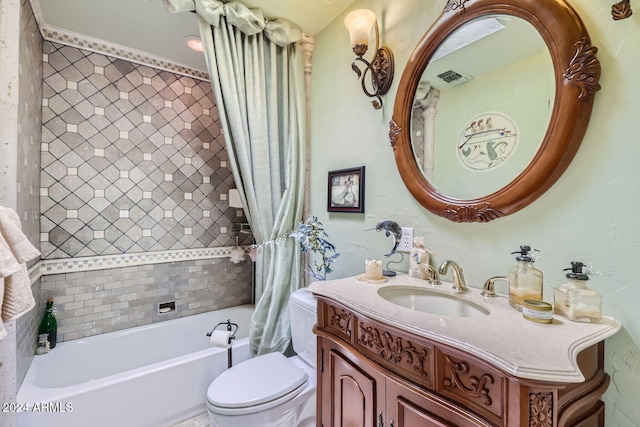 full bathroom featuring vanity, shower / bath combo with shower curtain, and toilet