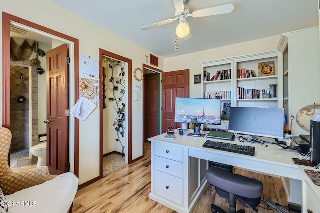 office space with ceiling fan and light hardwood / wood-style floors