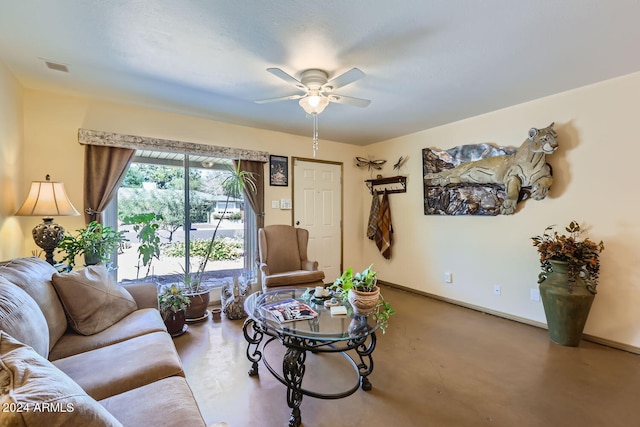 living room with concrete flooring and ceiling fan