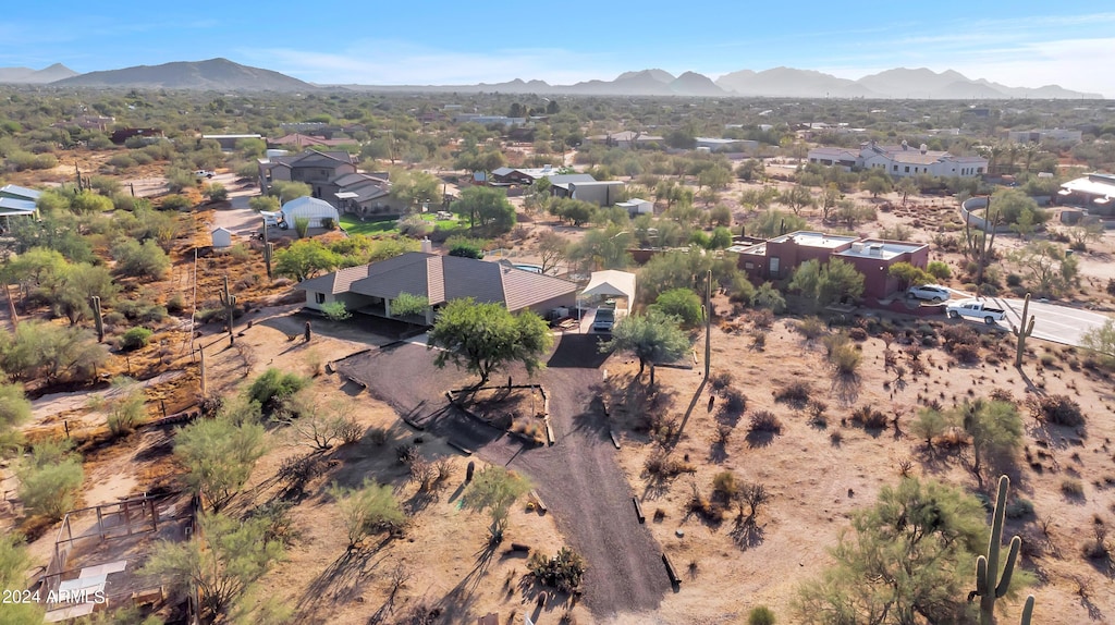 birds eye view of property with a mountain view