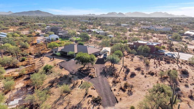 birds eye view of property with a mountain view