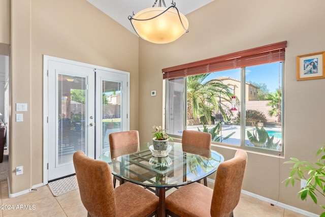 dining room featuring french doors and light tile patterned flooring