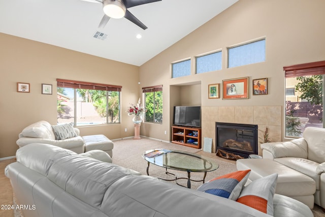 carpeted living room with high vaulted ceiling and ceiling fan