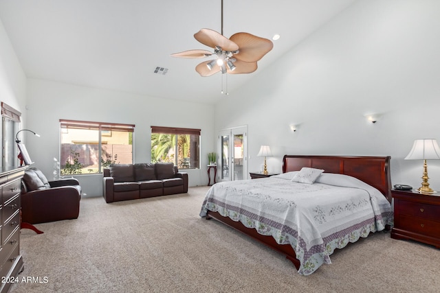 bedroom with high vaulted ceiling, light colored carpet, and ceiling fan