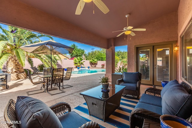 view of patio with ceiling fan, a fenced in pool, an outdoor living space, and french doors