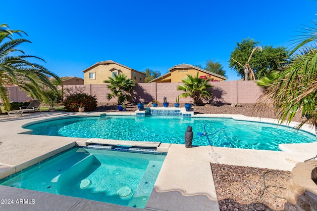 view of pool featuring an in ground hot tub and a patio