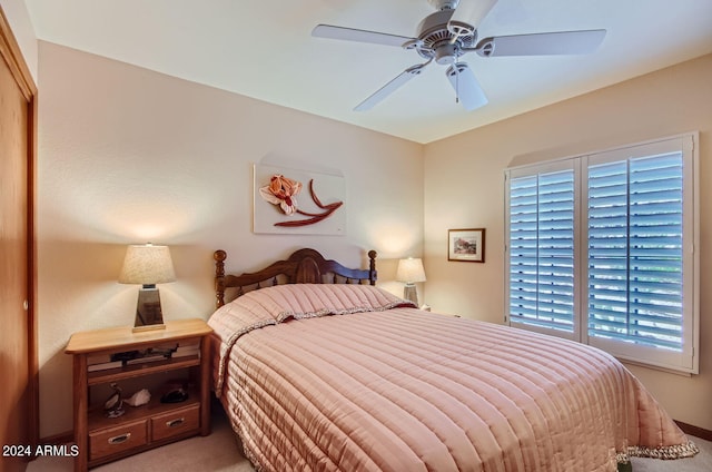 carpeted bedroom with ceiling fan