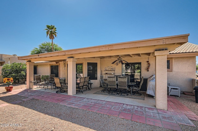 view of patio featuring ceiling fan and outdoor dining area