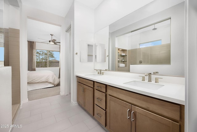 bathroom featuring vanity, ceiling fan, tile patterned flooring, and tiled shower