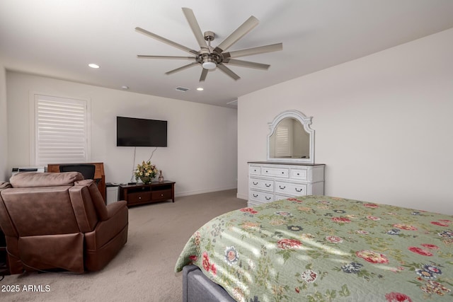 bedroom featuring ceiling fan and light carpet