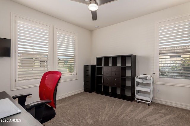 home office featuring light colored carpet and ceiling fan