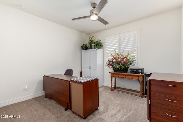 carpeted office featuring ceiling fan