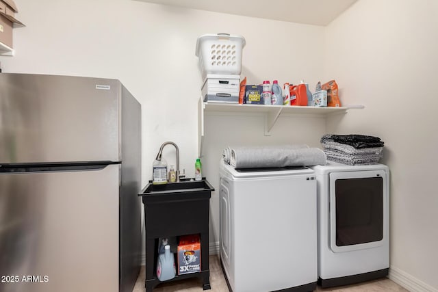 washroom with washer and dryer