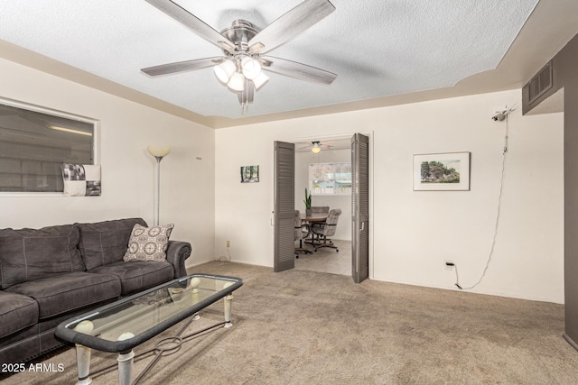 62 W Beall Ave, Mesa, AZ 85210 - carpeted living area with ceiling fan, a desk, and a textured ceiling
