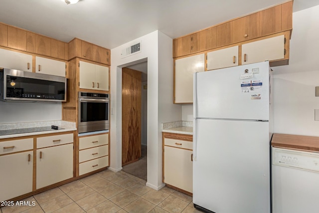 62 W Beall Ave, Mesa, AZ 85210 - kitchen with appliances with stainless steel finishes, light countertops, and light tile patterned floors