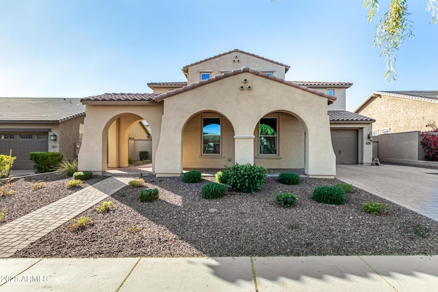 mediterranean / spanish-style house featuring a garage