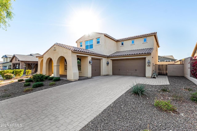 mediterranean / spanish-style house featuring a garage