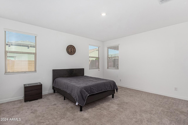 bedroom featuring light carpet