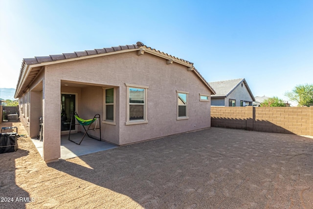 rear view of house featuring a patio