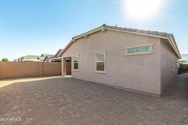 back of property featuring a patio