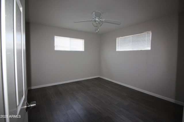 unfurnished room featuring ceiling fan and dark hardwood / wood-style flooring