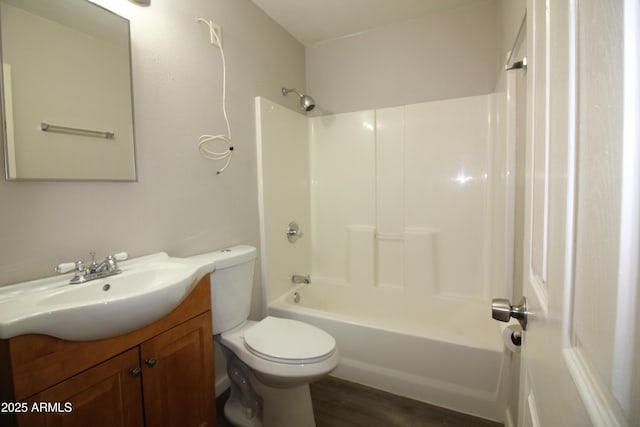 full bathroom with vanity, hardwood / wood-style floors, bathing tub / shower combination, and toilet