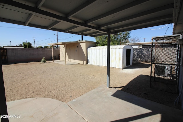 view of patio with a shed