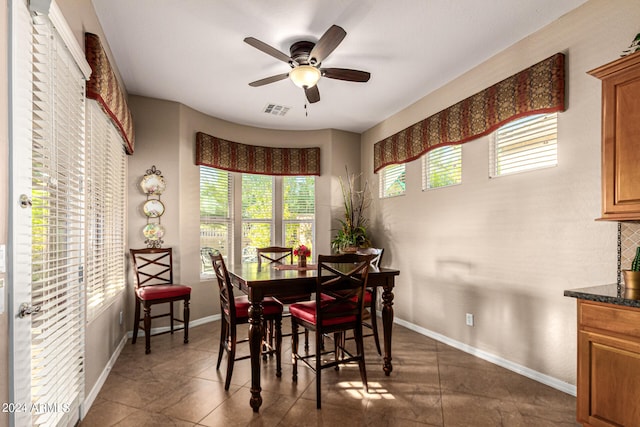 dining area featuring visible vents, ceiling fan, and baseboards