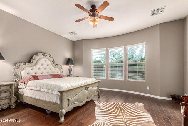 bedroom featuring dark wood-style floors, baseboards, and visible vents