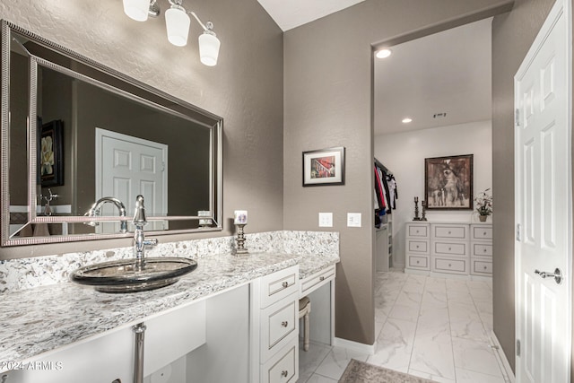 bathroom featuring recessed lighting, vanity, baseboards, marble finish floor, and a closet