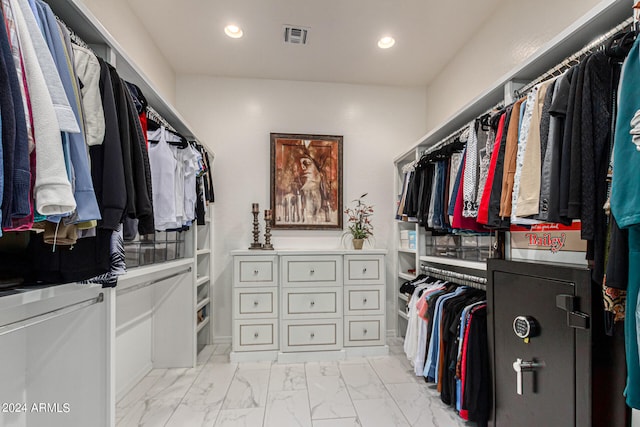 spacious closet featuring marble finish floor and visible vents