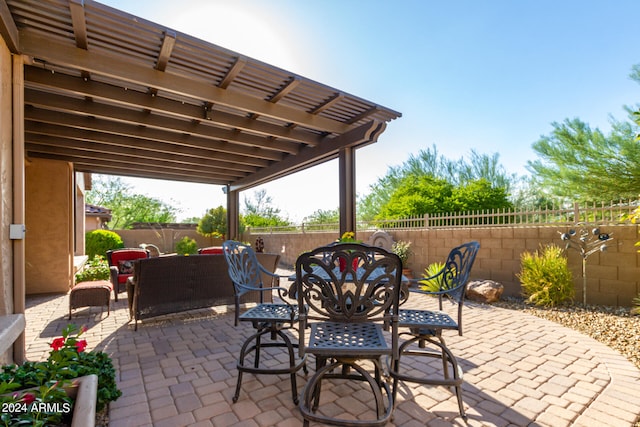 view of patio featuring outdoor dining area, a fenced backyard, outdoor lounge area, and a pergola