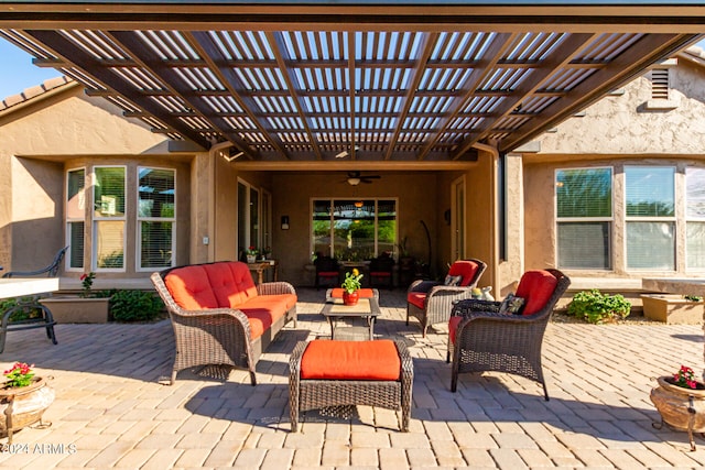 view of patio featuring outdoor lounge area, ceiling fan, and a pergola