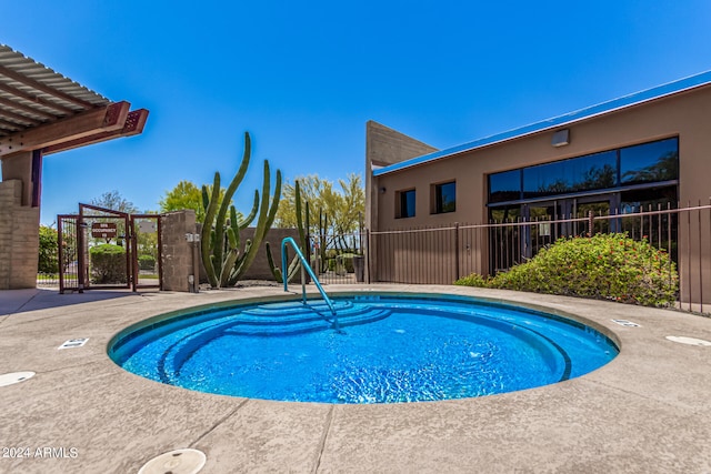 view of pool with fence and a pool