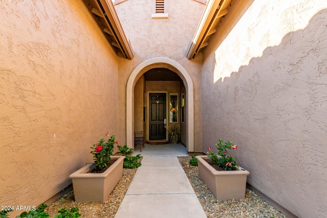 doorway to property with stucco siding